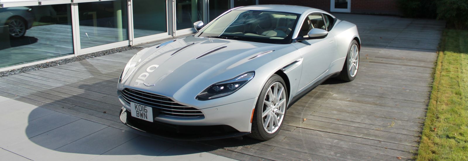 Decorative element exterior on a silver Aston Martin