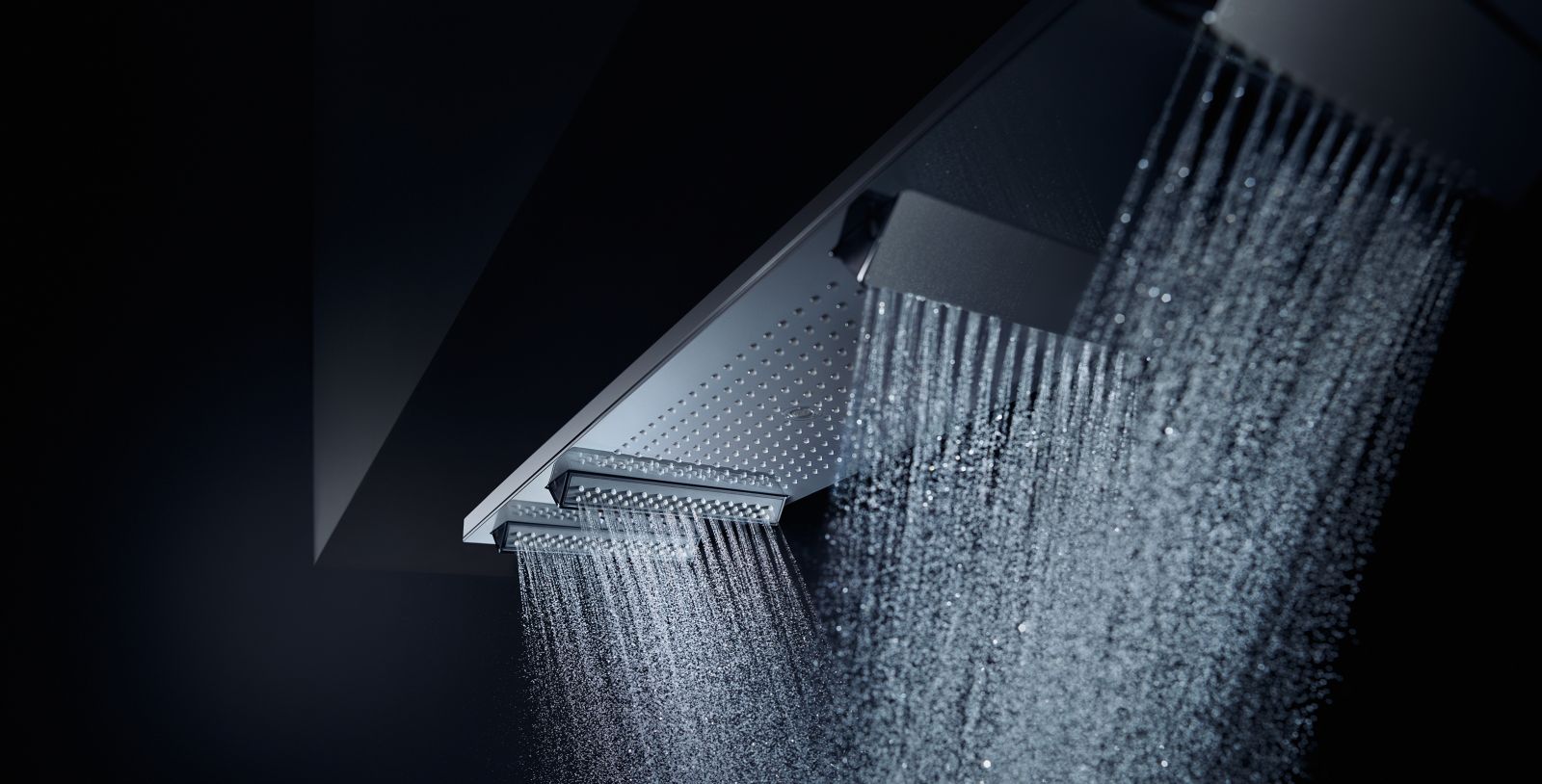 Large rectangular shower head from which water comes